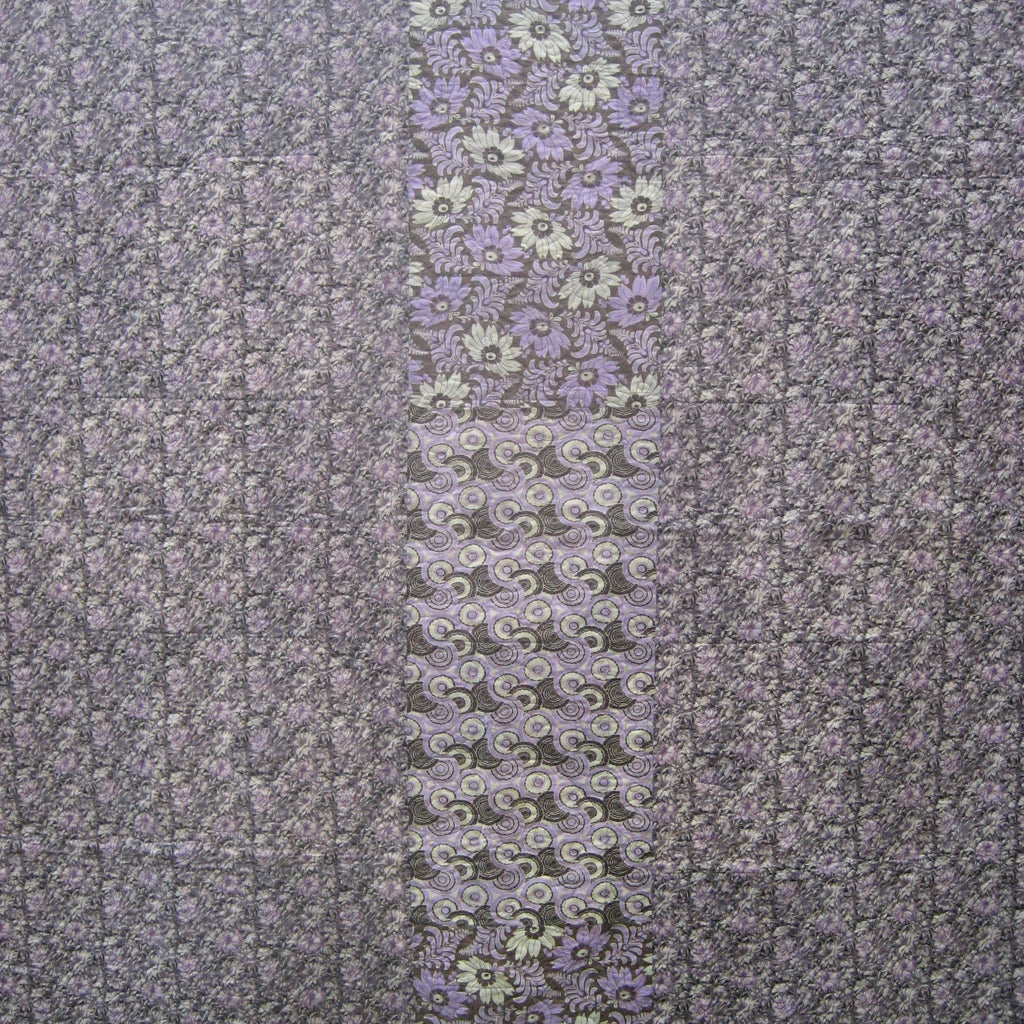 Quilt close up of a purple floral print