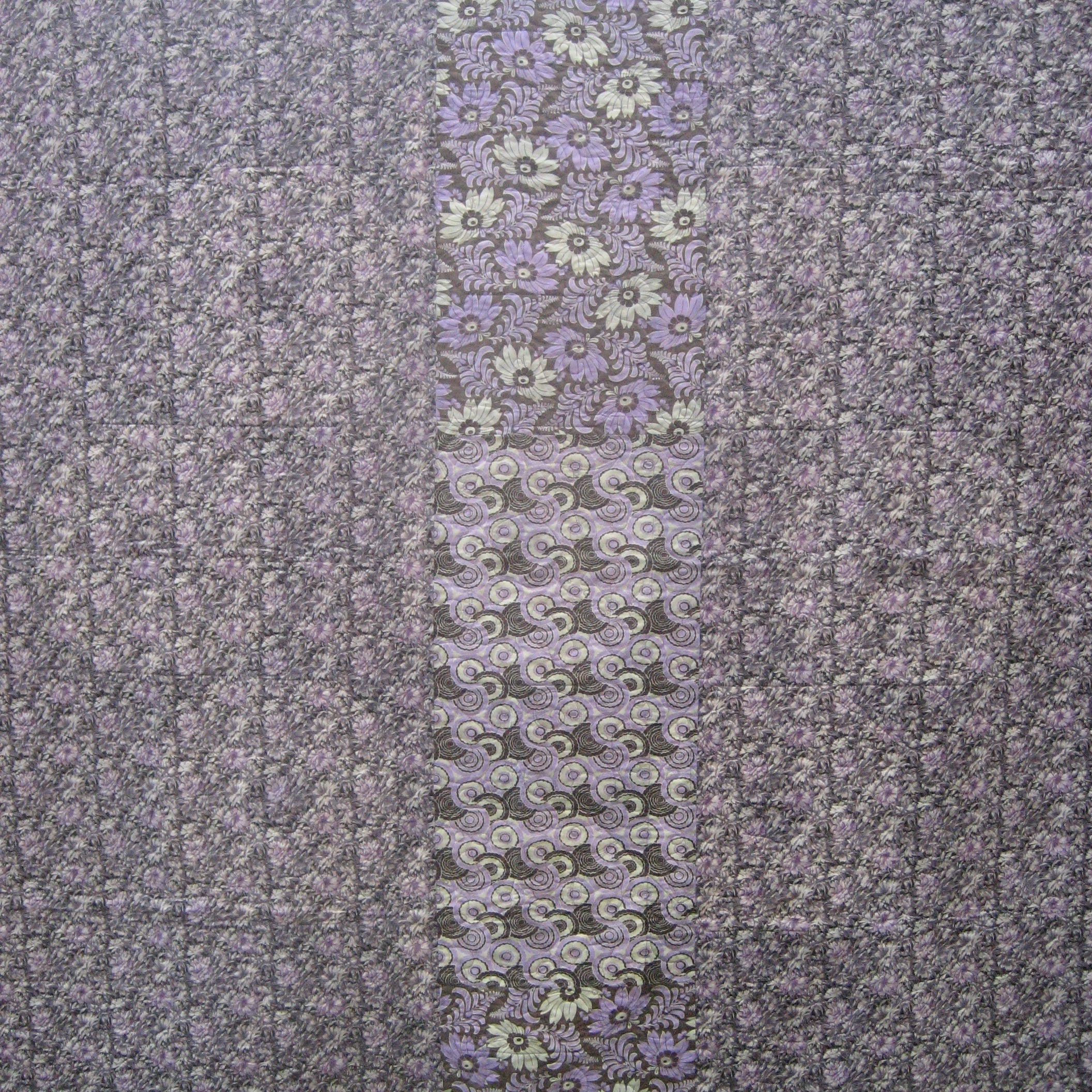 Quilt close up of a purple floral print