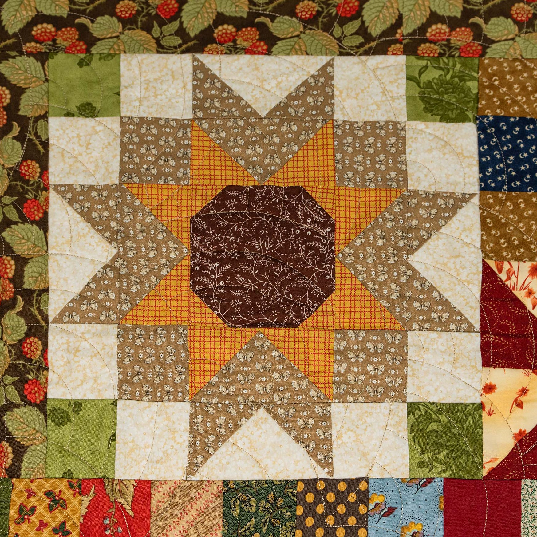 Patchwork quilt with star pattern and floral border