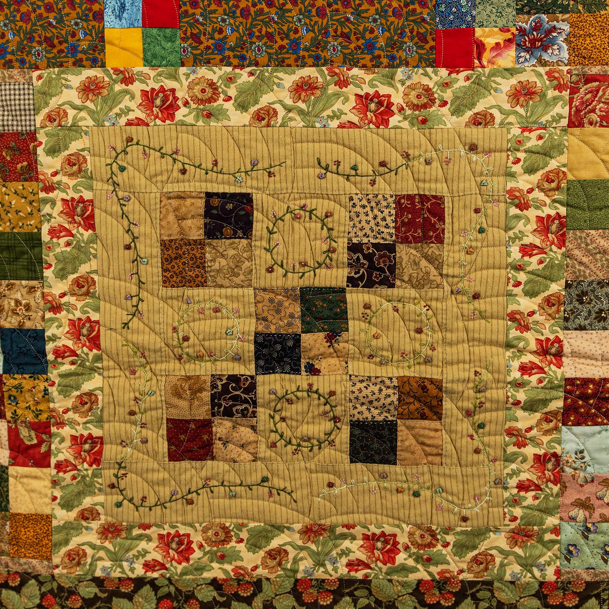 Patchwork quilt with floral patterns and a heart design