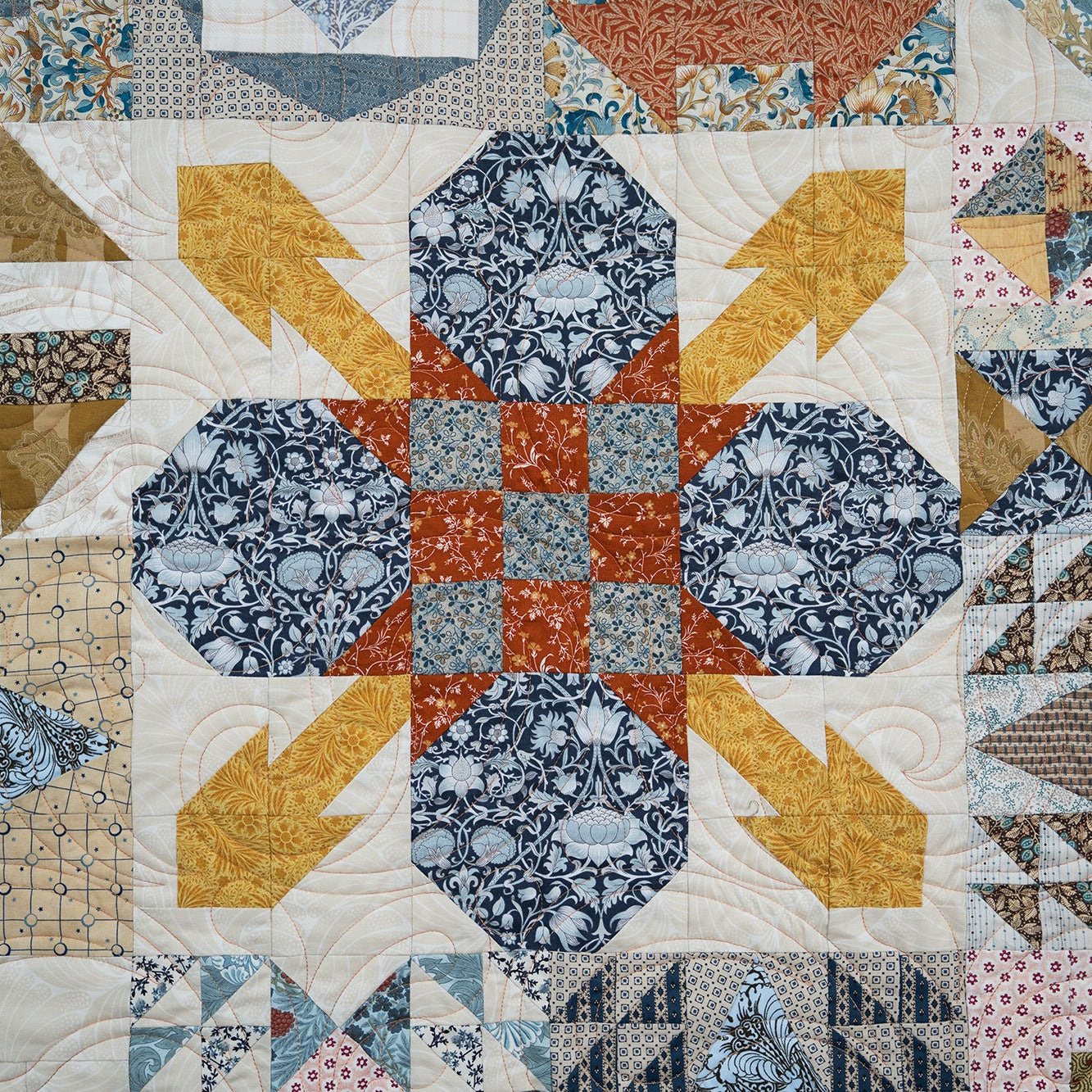 Quilt with geometric pattern featuring various shapes and colors