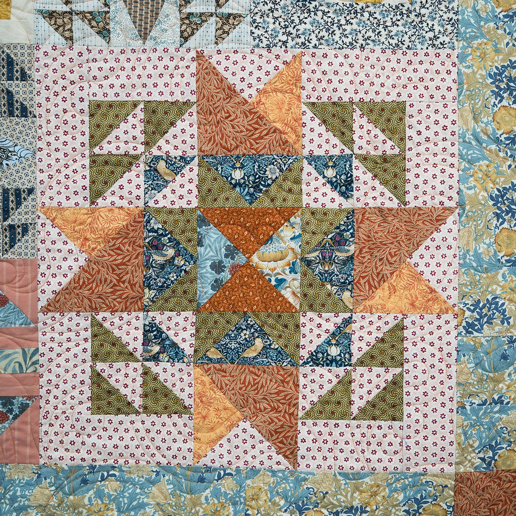 Colorful quilt with geometric patterns in various colors