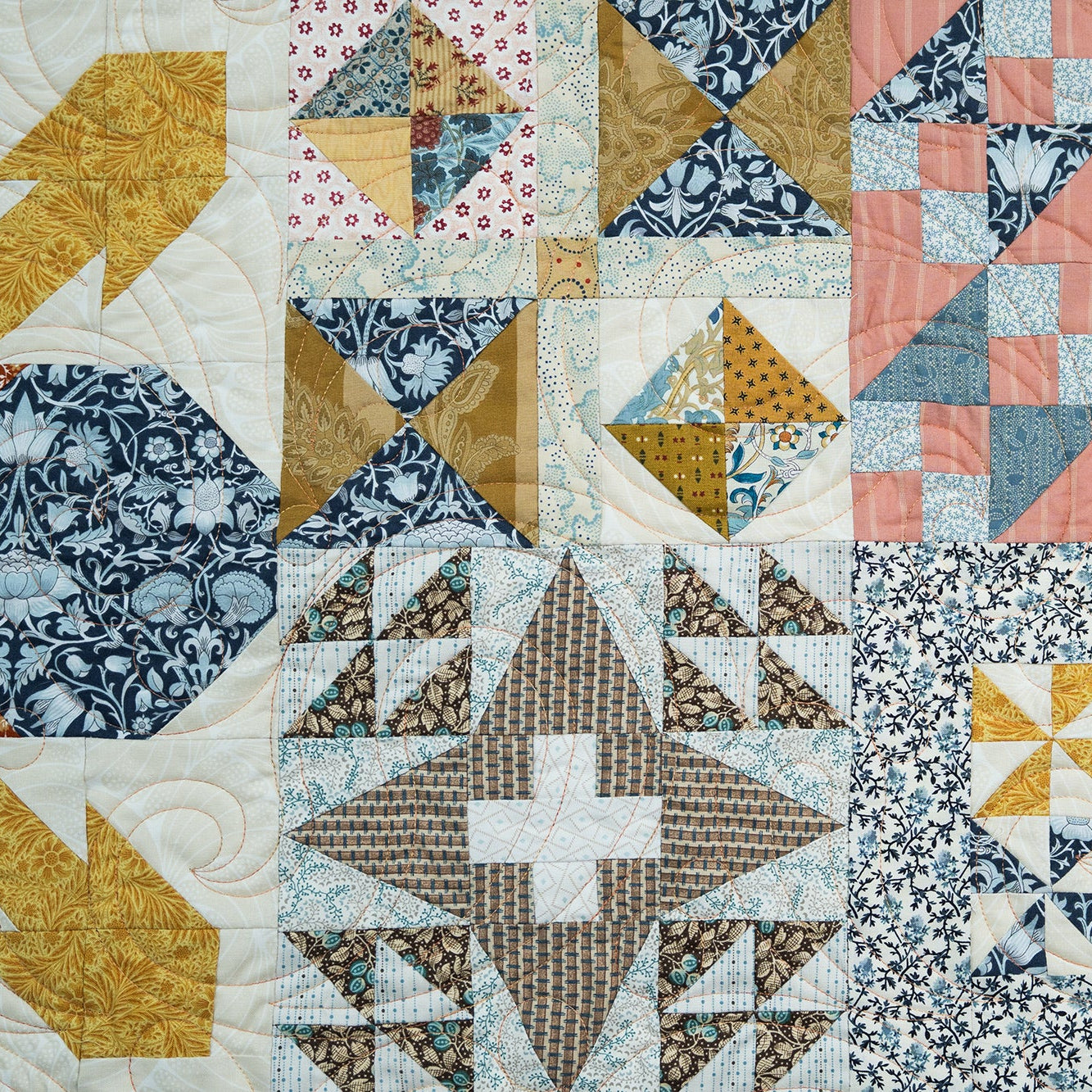 Quilt with various geometric patterns in multicolors