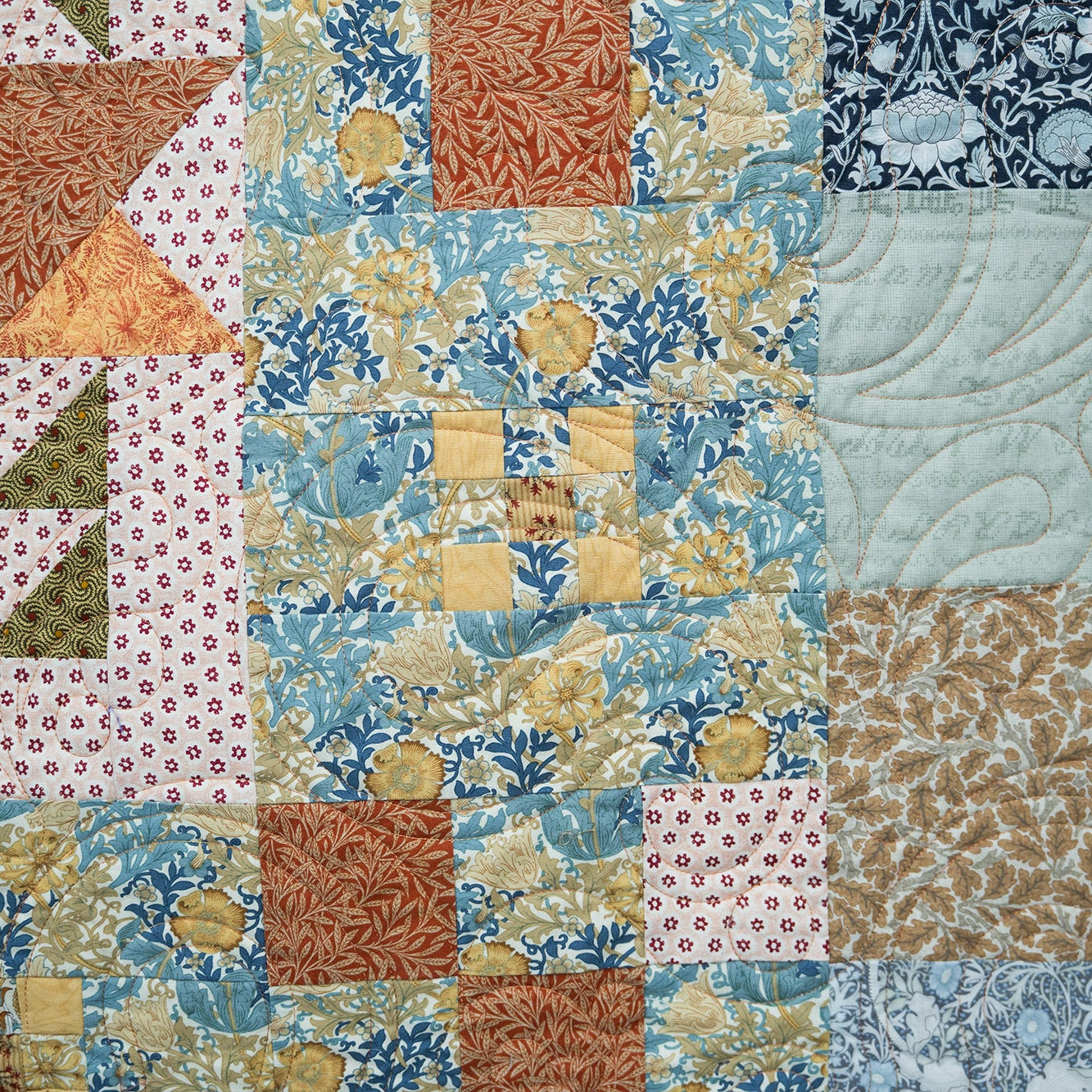 Patchwork quilt with various patterns and colors