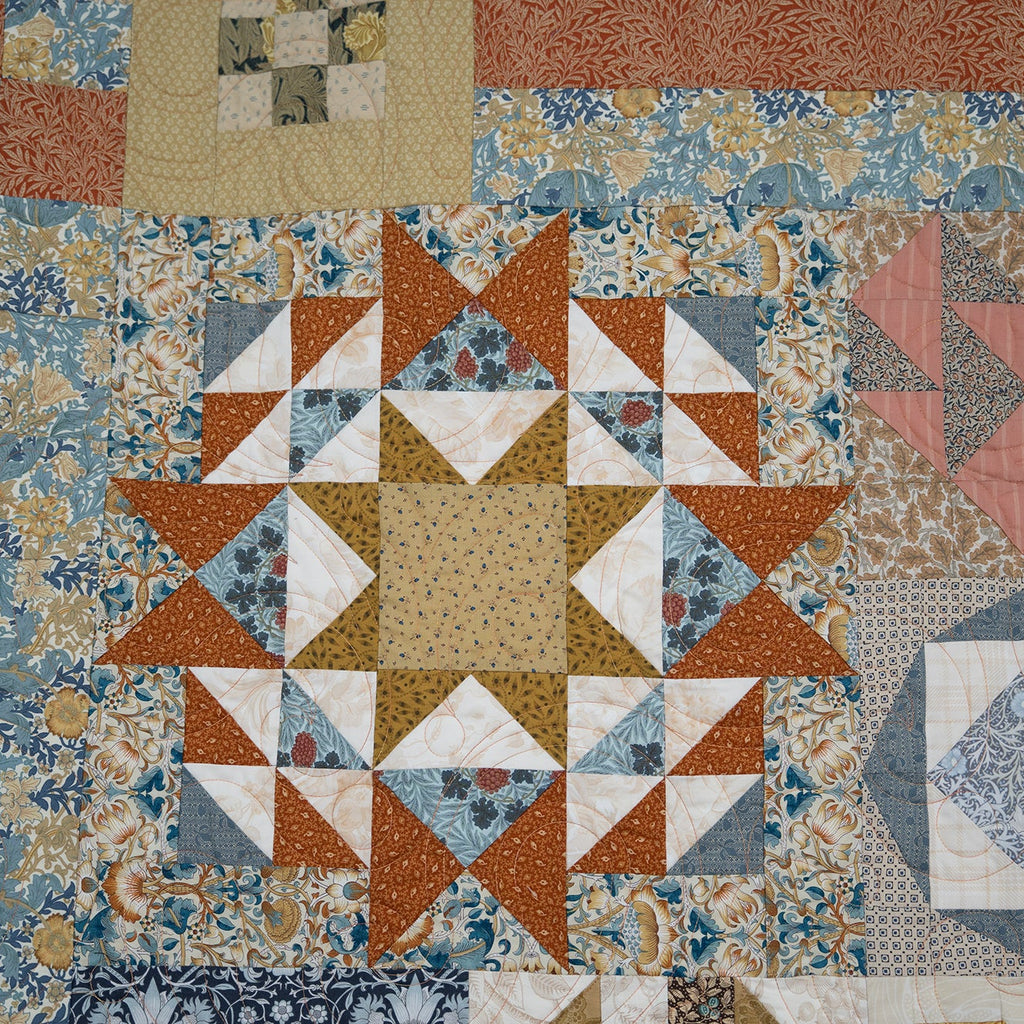 Quilt with geometric patterns in various colors