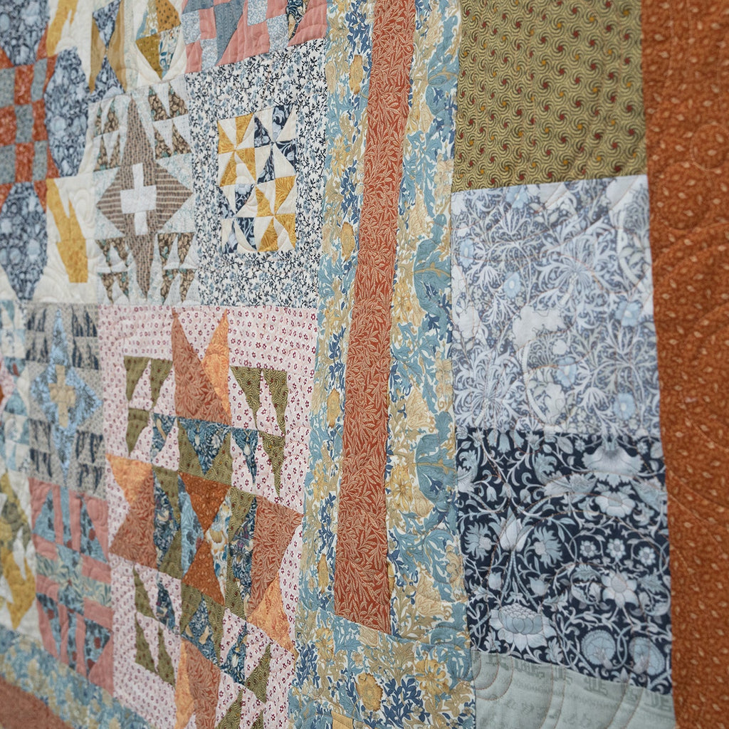 Patchwork quilt with various patterns and colors