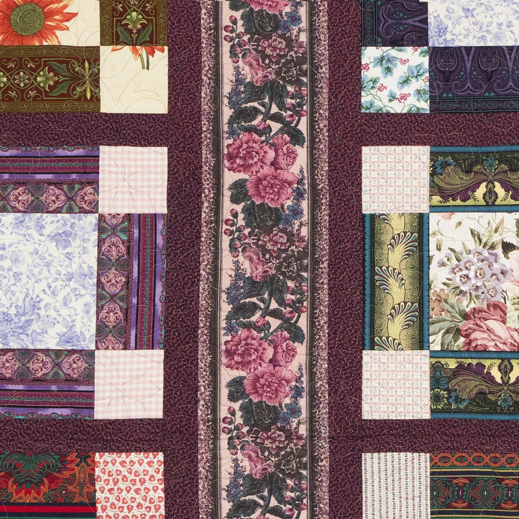 Patchwork quilt with floral and geometric patterns