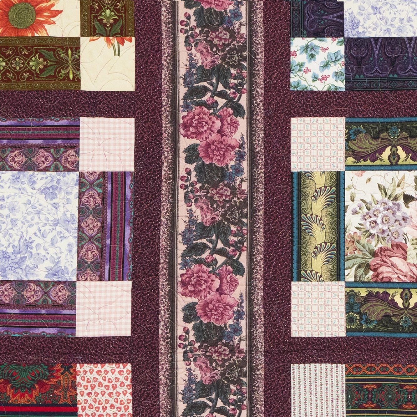 Patchwork quilt with floral and geometric patterns