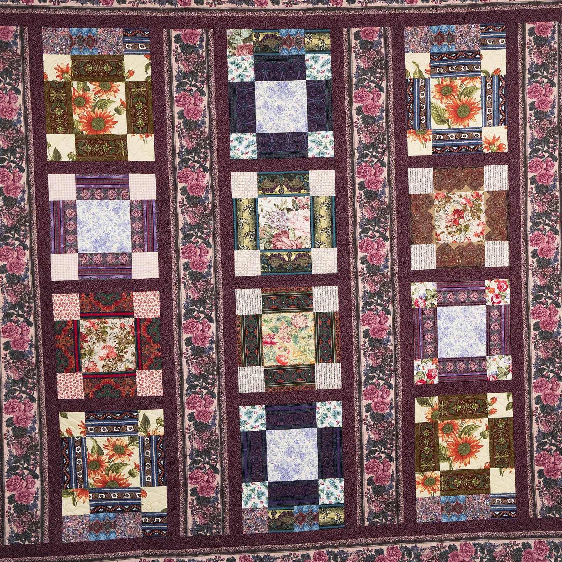 Patchwork quilt with floral patterns