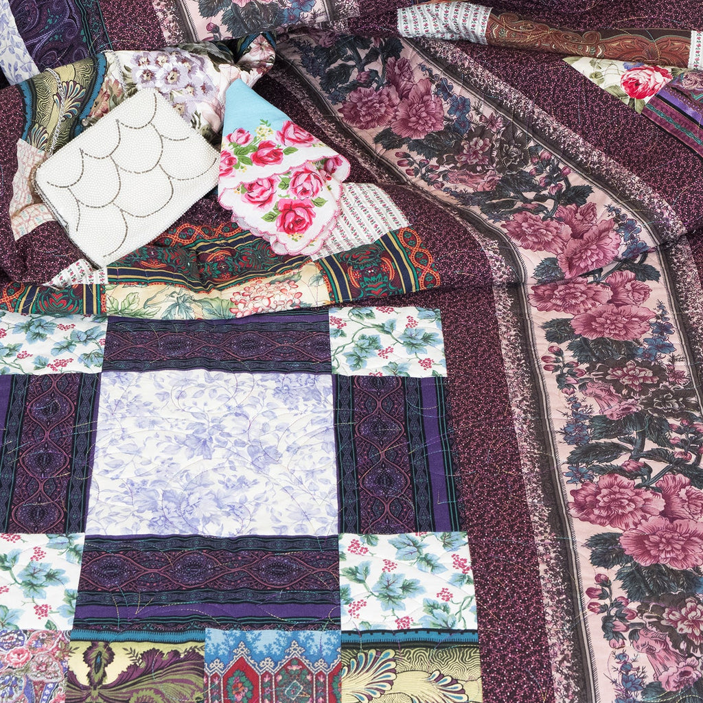 Patchwork quilt with floral and geometric patterns