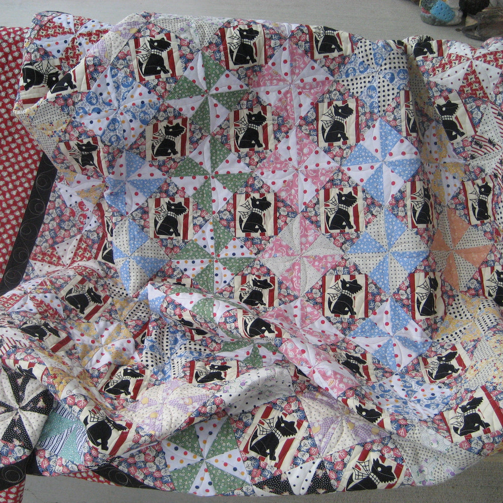 Quilt with dog pattern on a chair