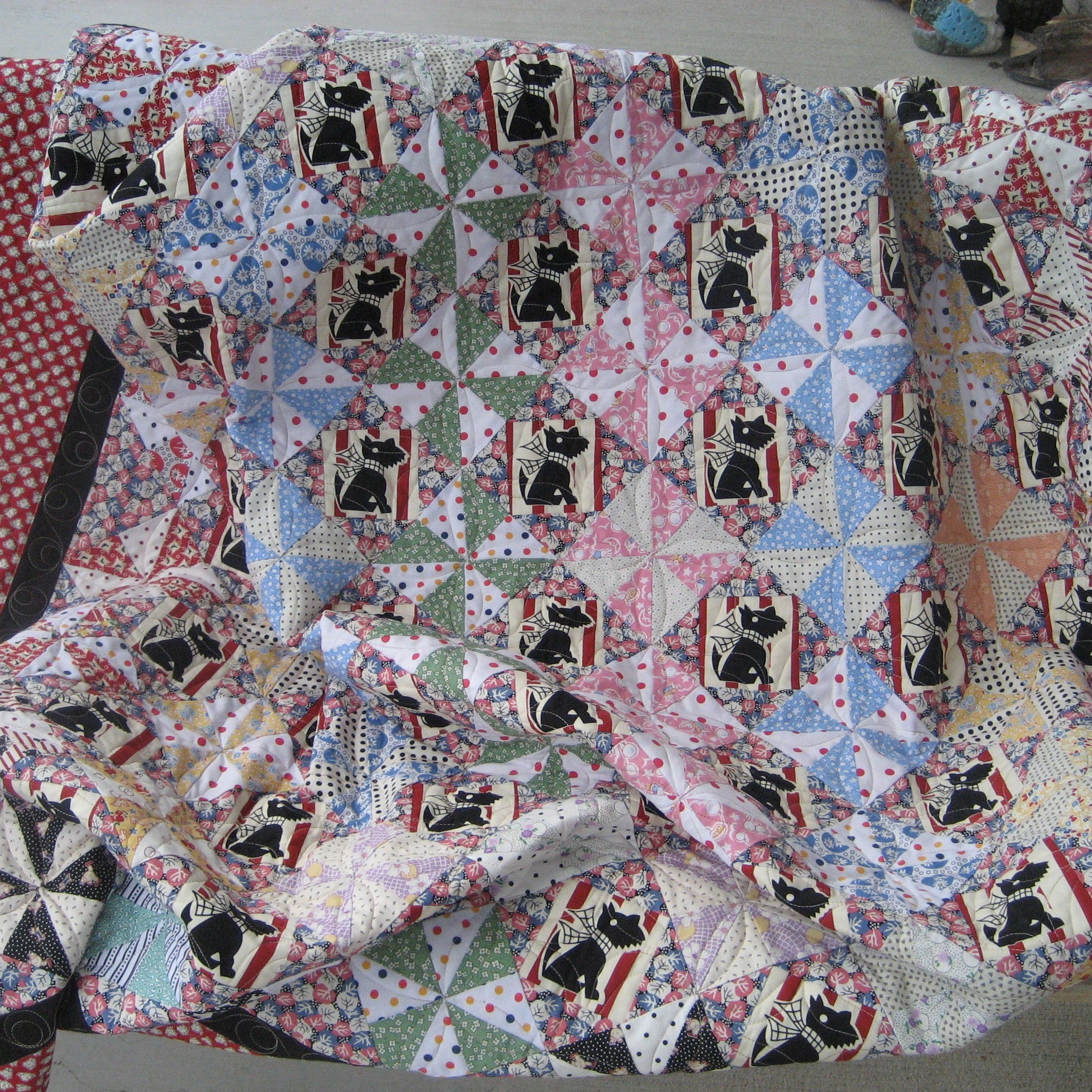 Quilt with dog pattern on a chair