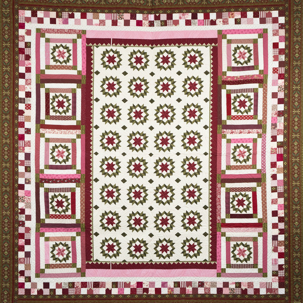 Quilt with a patchwork design featuring pink, green, and white colors on a brown border.