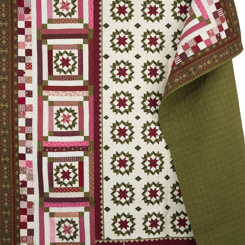 Quilt with geometric pattern on a white background