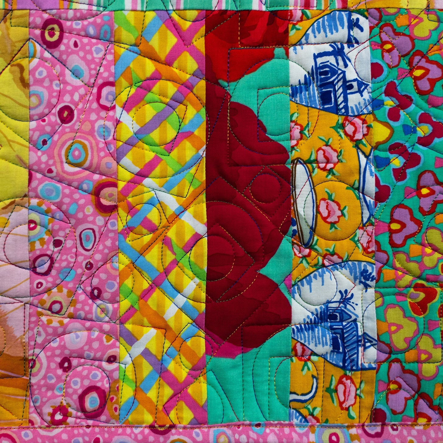 Colorful quilt with various patterns and colors