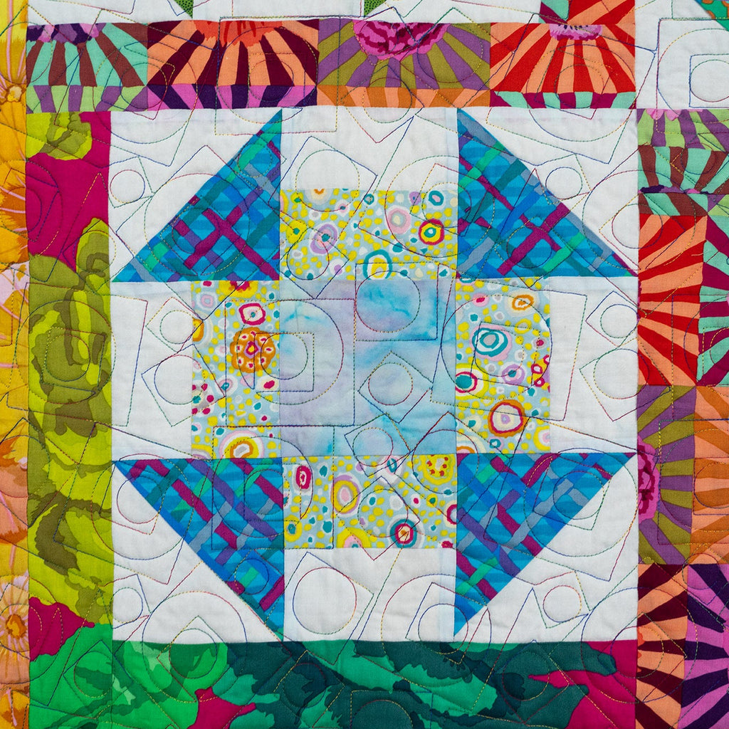 Colorful quilt with geometric patterns and vibrant colors