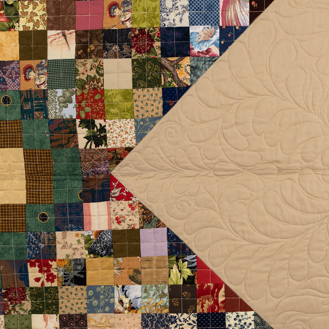 Patchwork quilt with a floral pattern on a beige background
