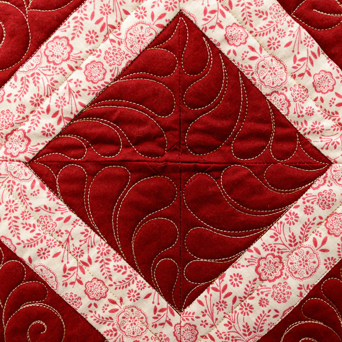 Quilt block with red and white pattern