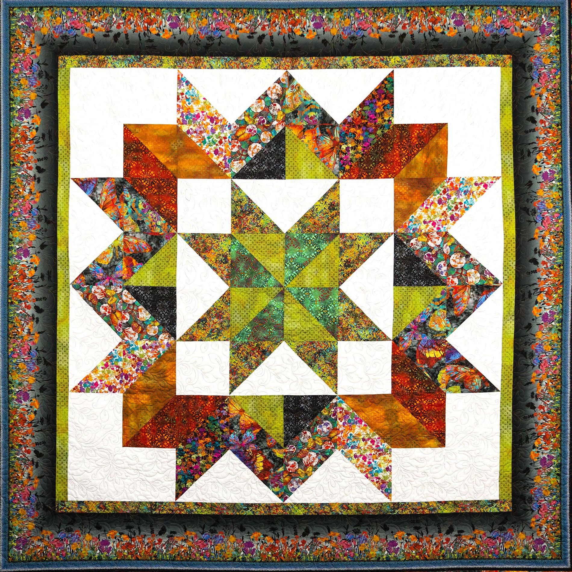 Colorful quilt with star pattern and floral border