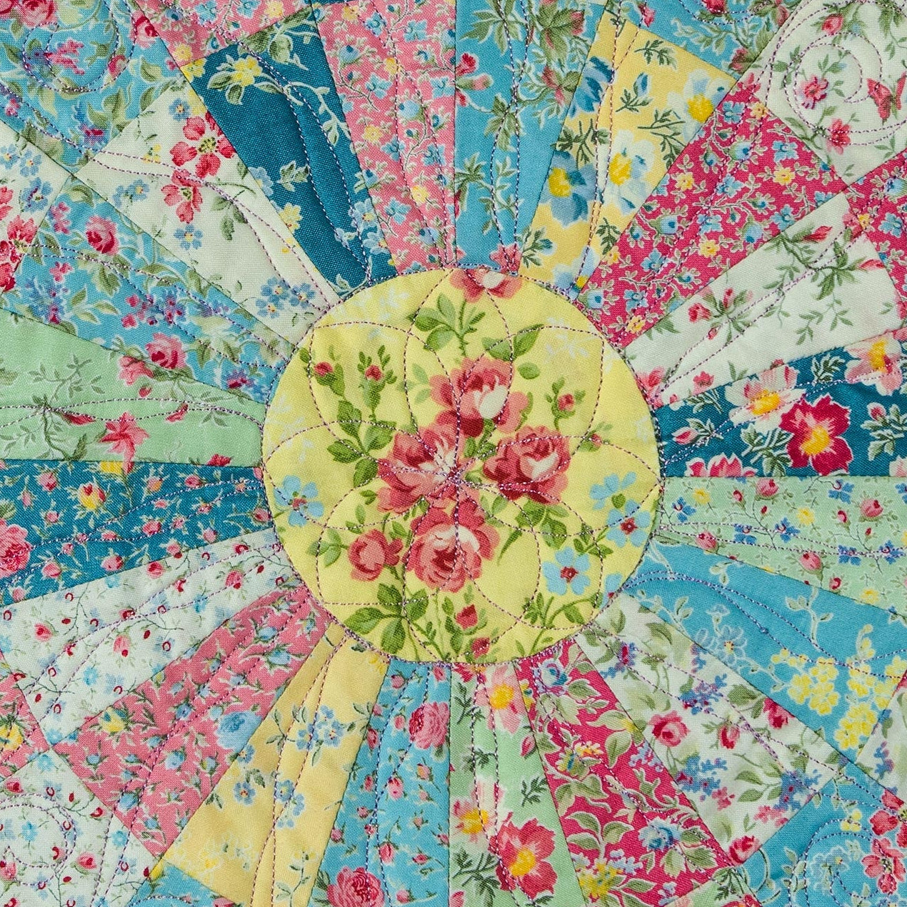 Patchwork quilt with floral patterns on