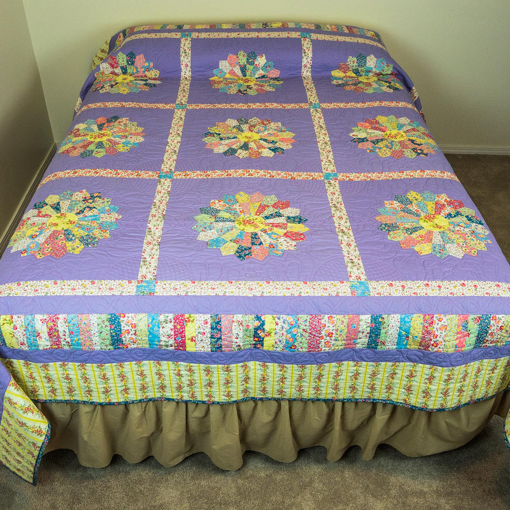 Colorful quilt with floral patterns on a bed