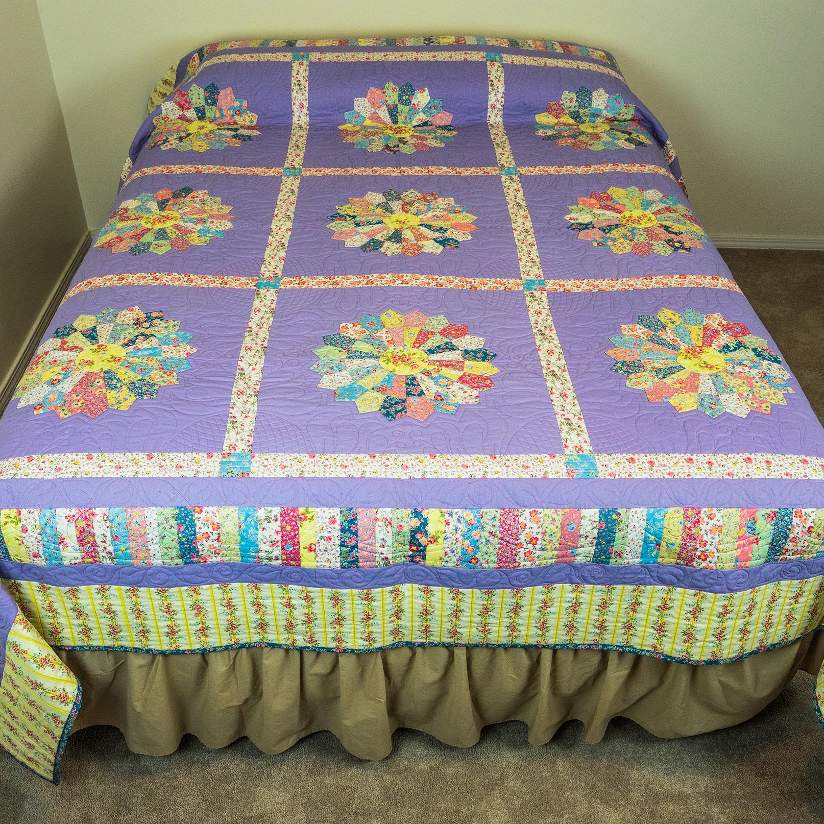 Colorful quilt with floral patterns on a bed