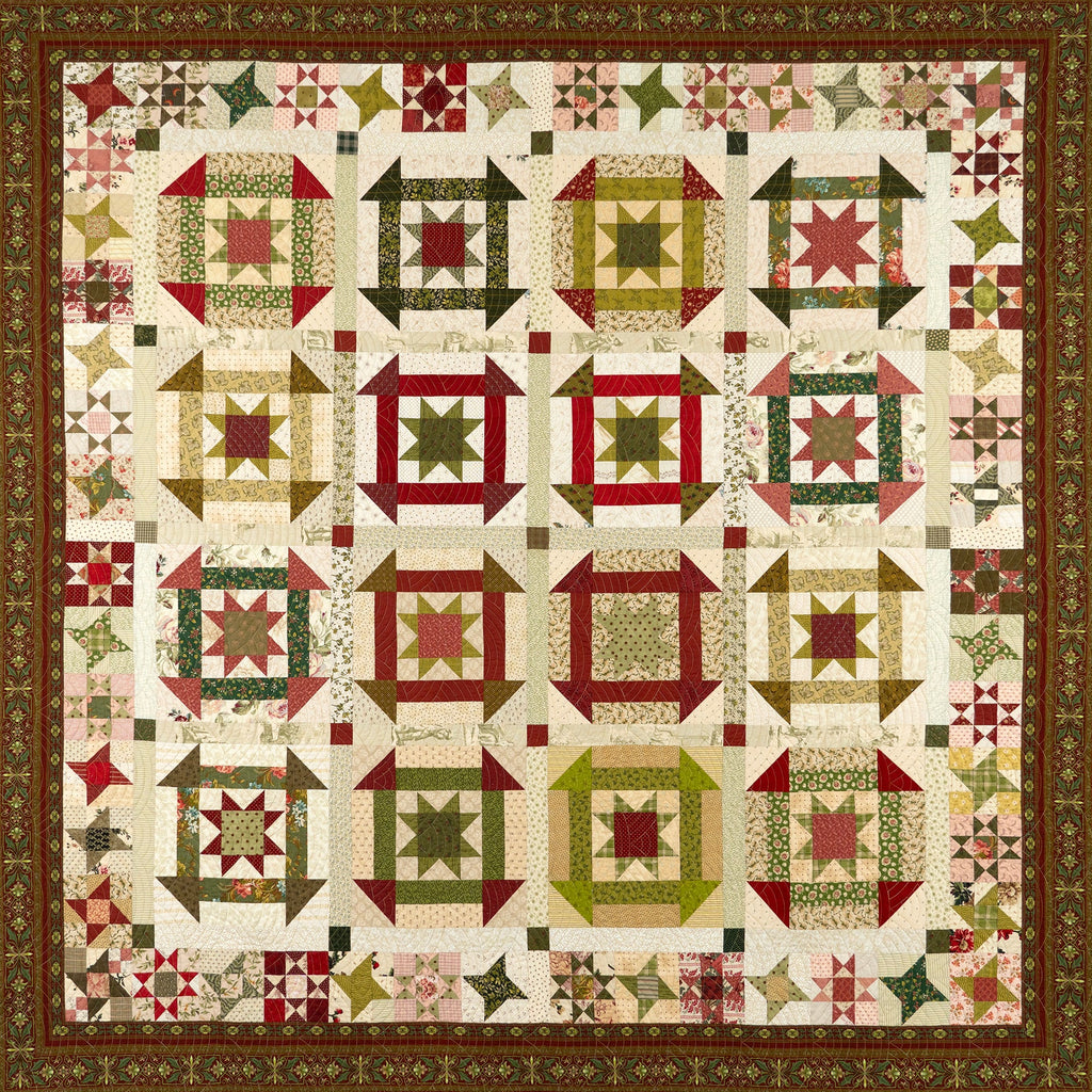 Flat lay of a quilt in a churn dash pattern in red and green colours with a floral border
