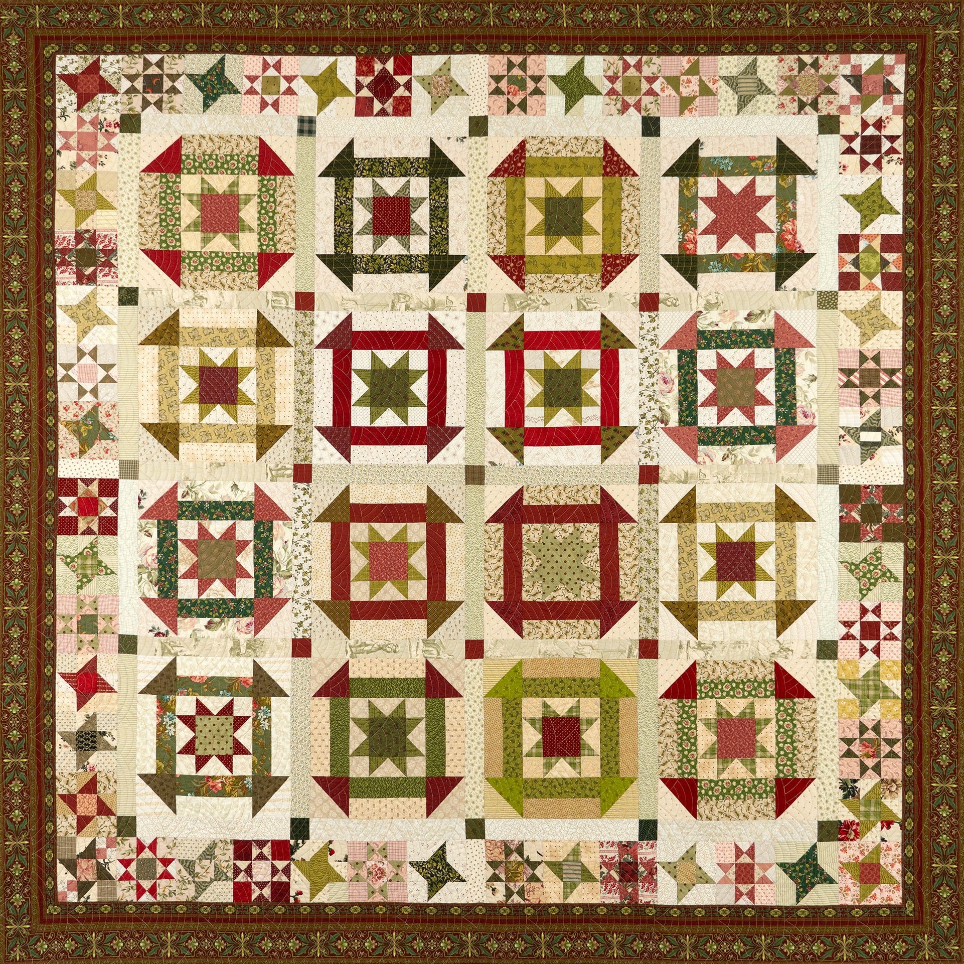 Flat lay of a quilt in a churn dash pattern in red and green colours with a floral border