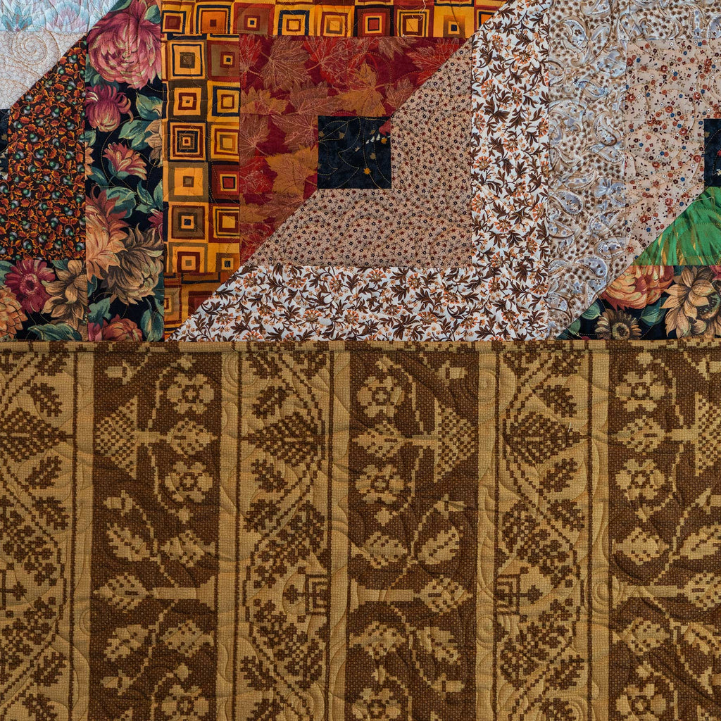 Quilt block with a variety of floral and leaf prints in brown and neutral tones.