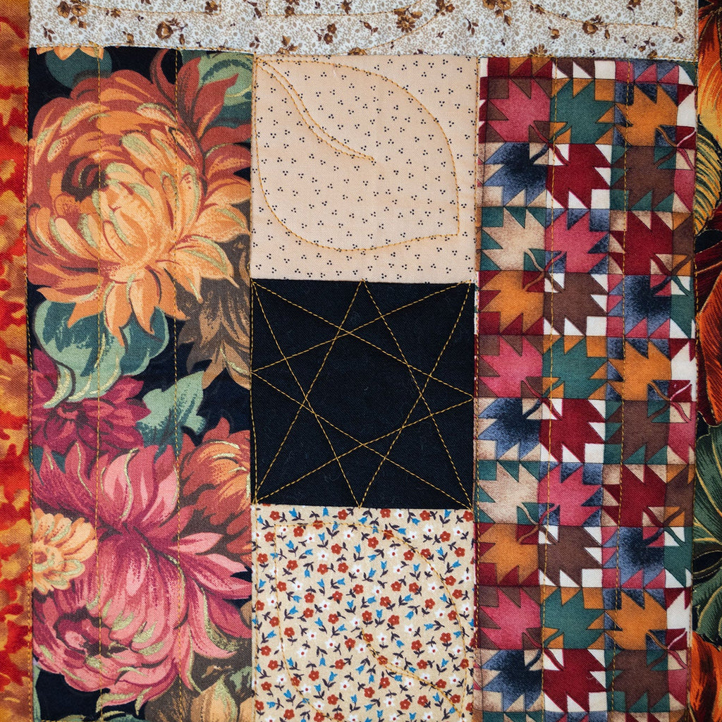 Collection of various quilt patterns with a mix of floral, geometric, and abstract designs.