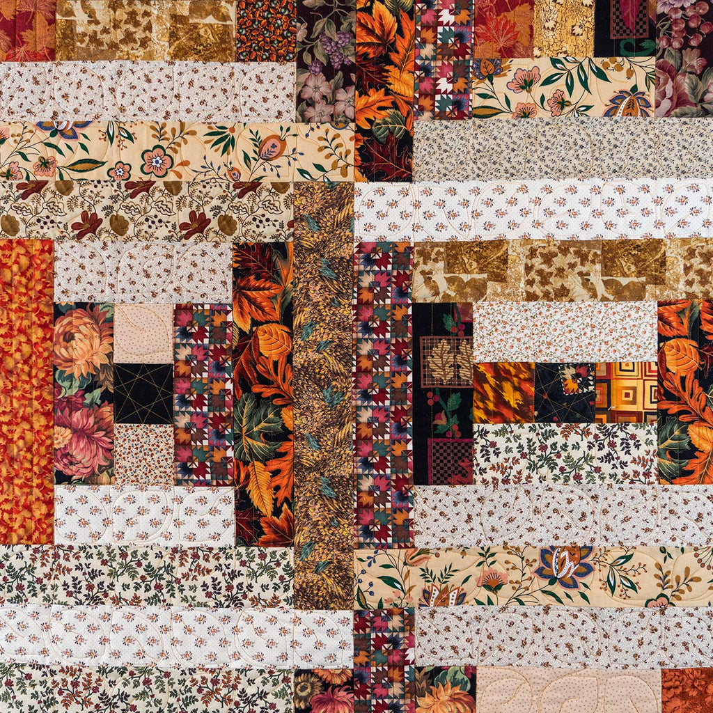 Patchwork quilt with various patterns and colors