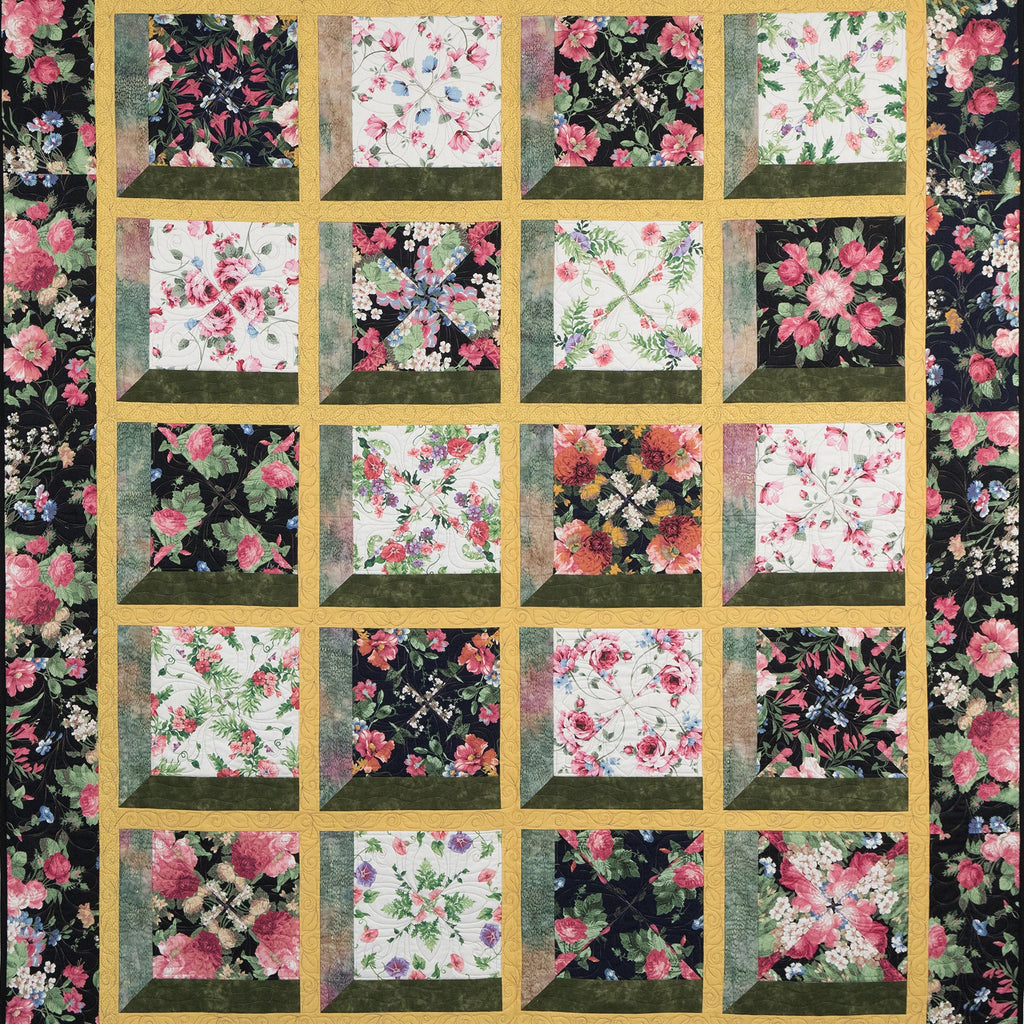 Floral quilt with a black background featuring a grid of square patterns.