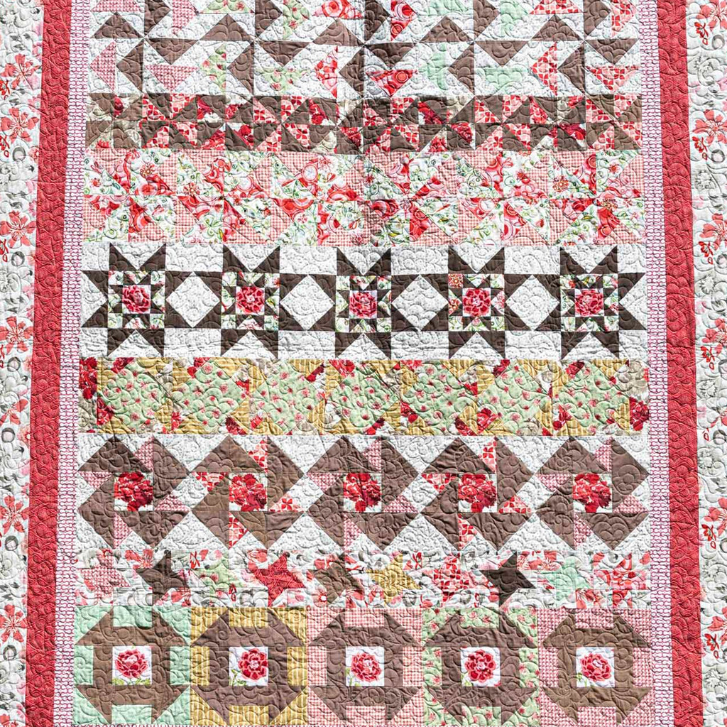 Quilt with floral and geometric patterns