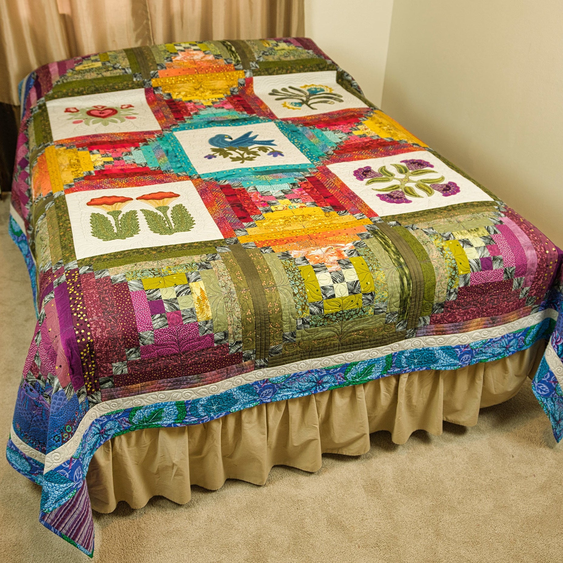 Colourful quilt laid out on a bed