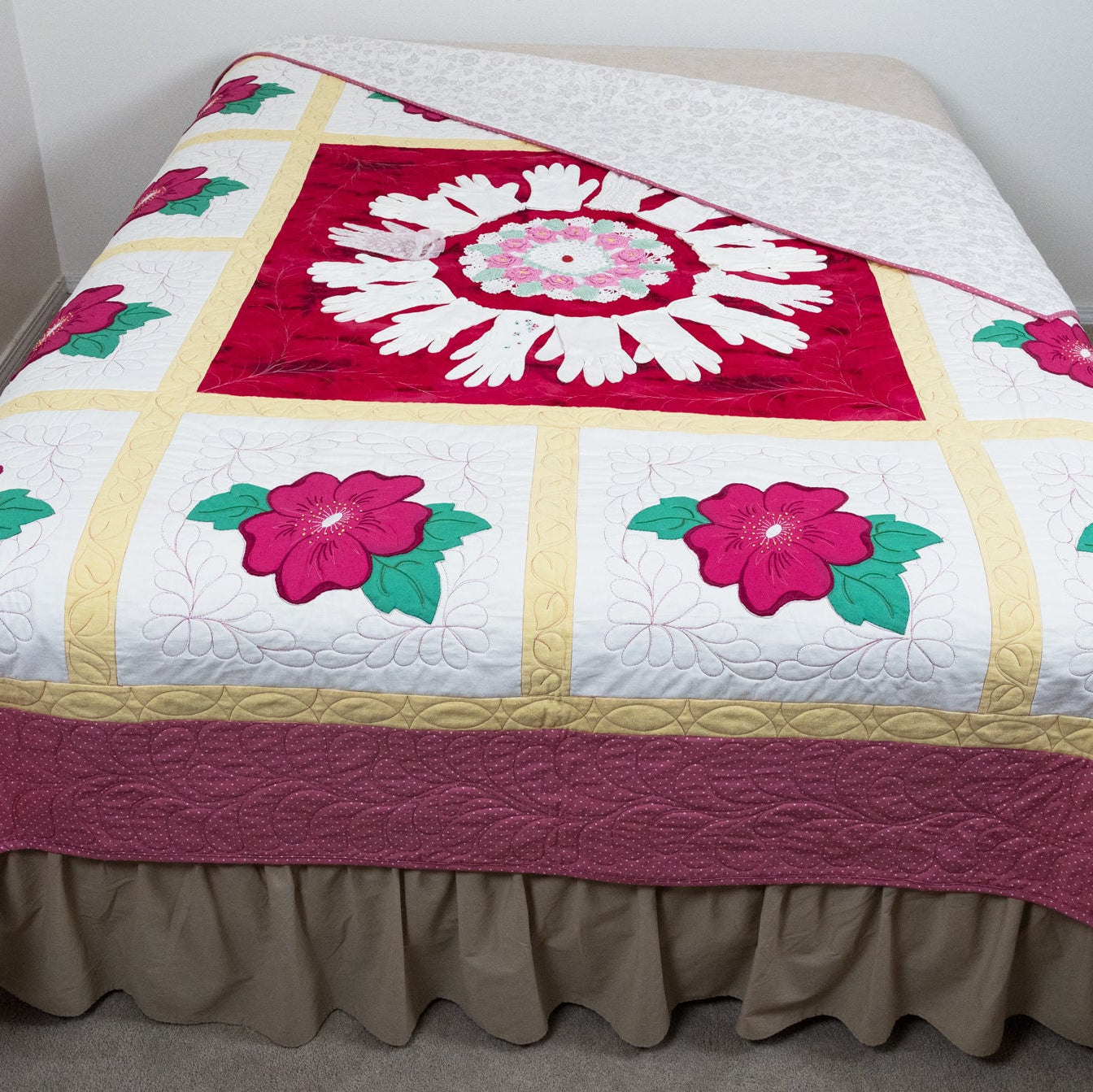 Quilt with floral patterns on a bed