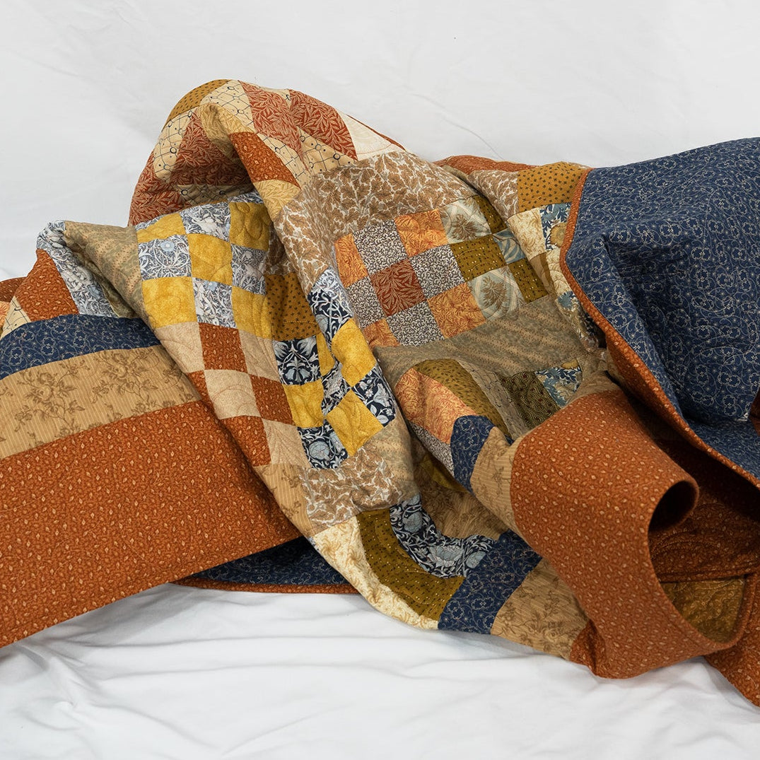 Stack of patterned fabric pieces on a white background