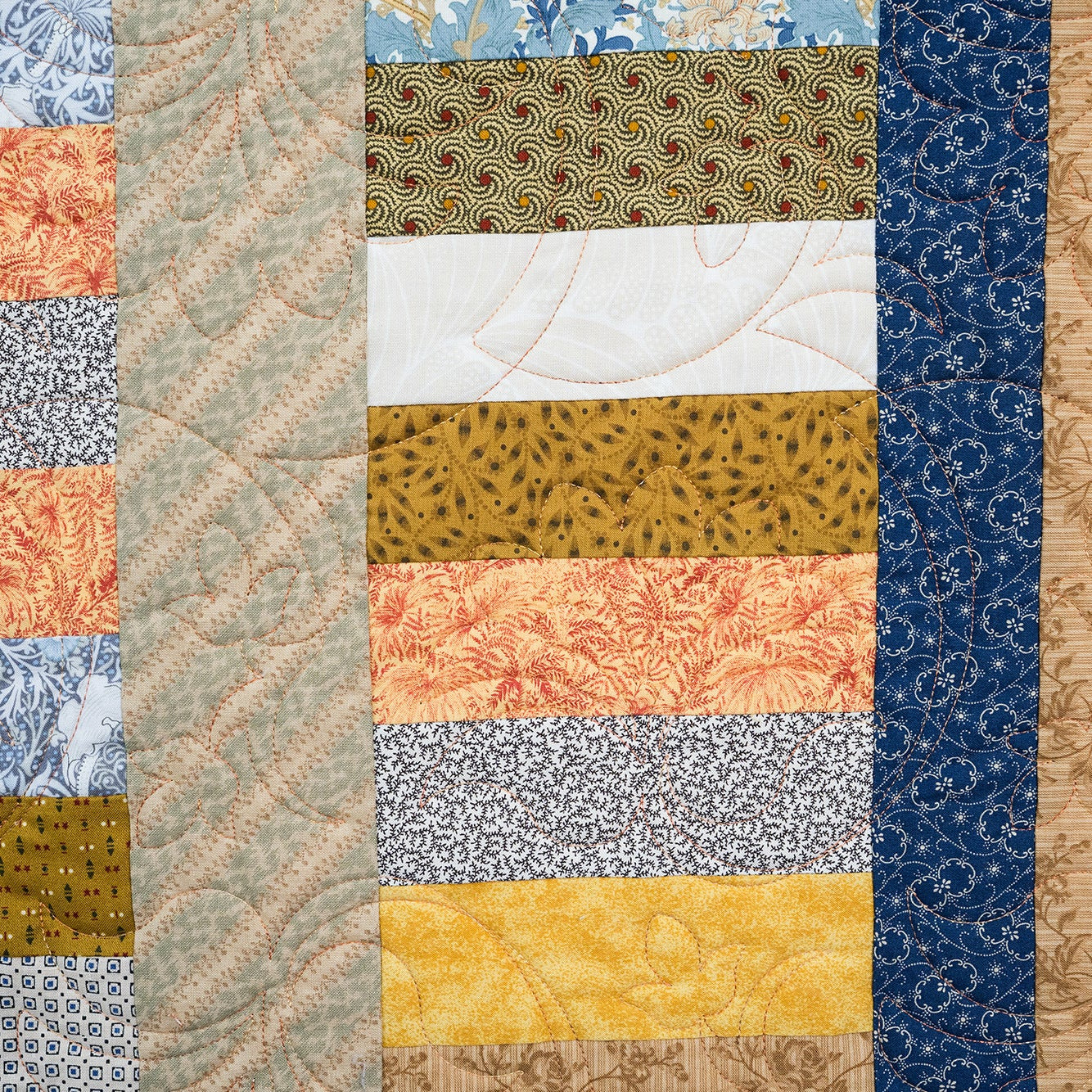 Patchwork quilt with various patterns and colors