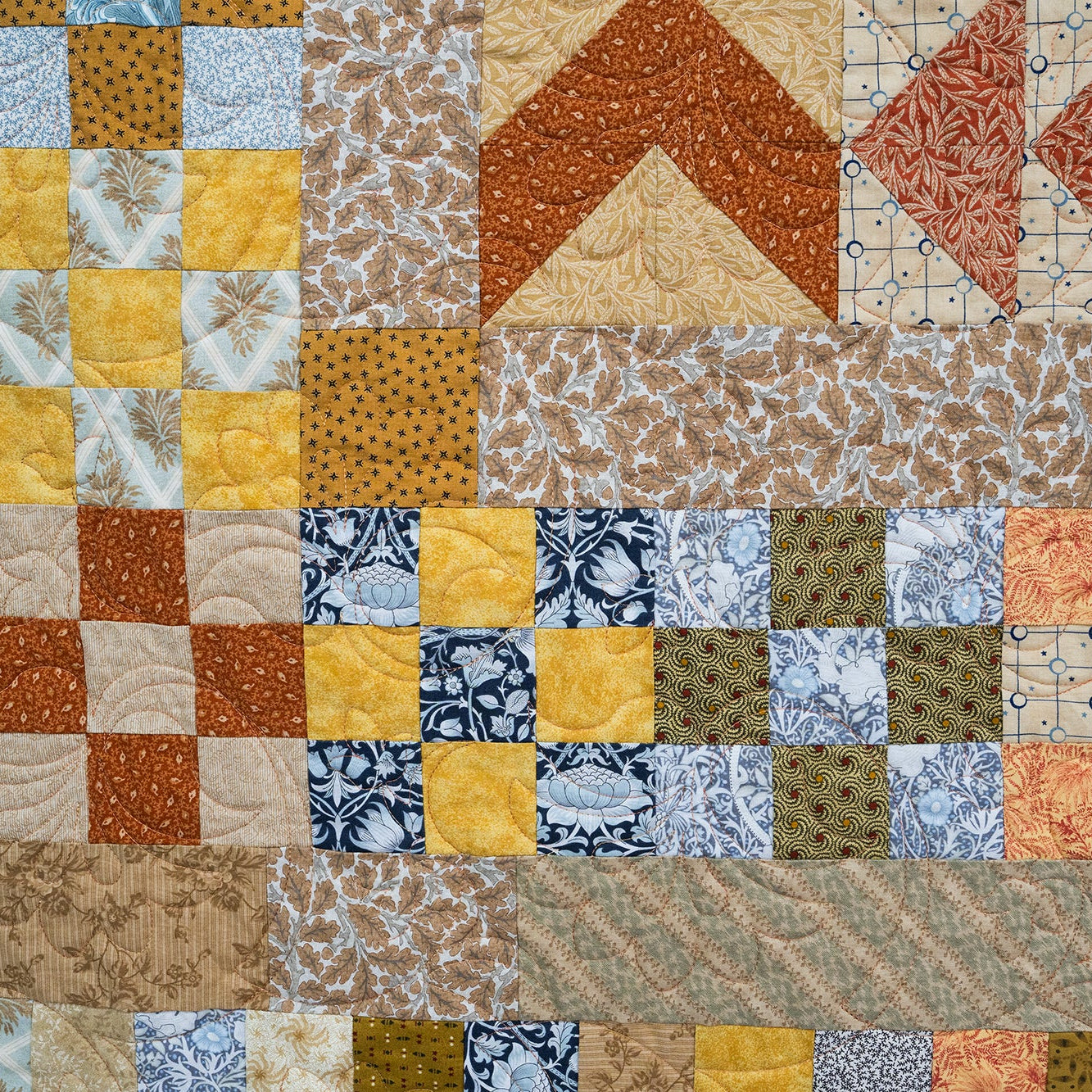 Patchwork quilt with various patterns and colors