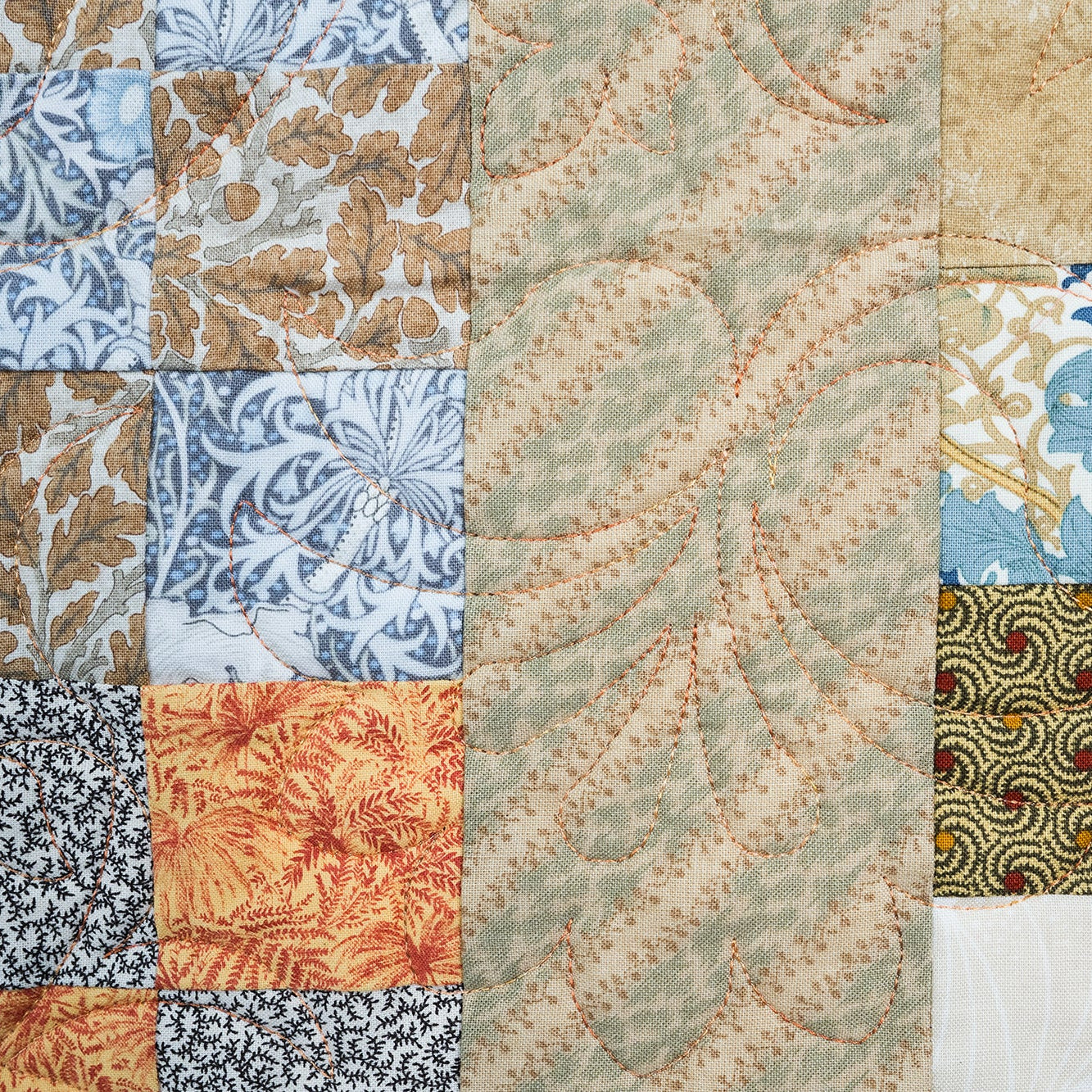 Collection of various textured fabric patterns in a patchwork arrangement.