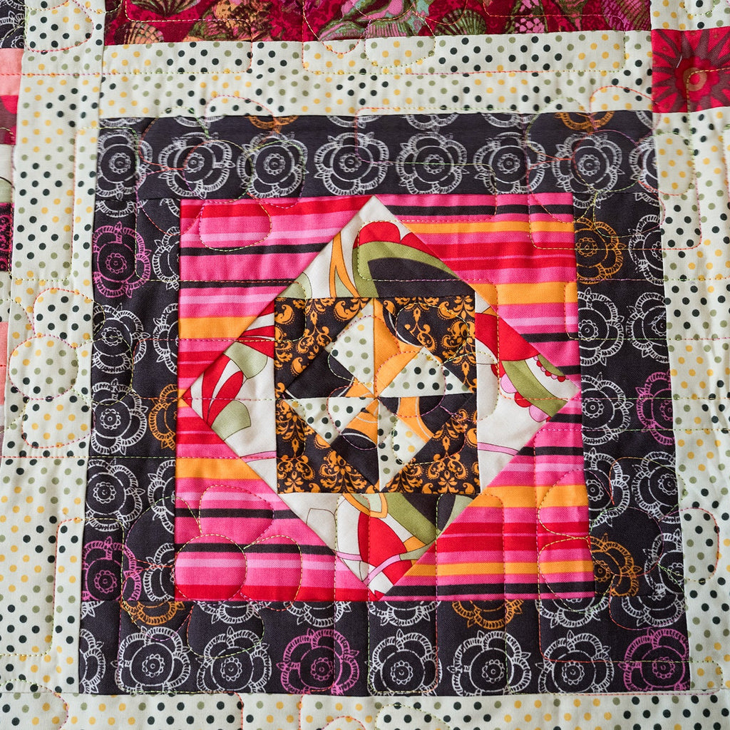 Quilt block with colorful pattern on a white background