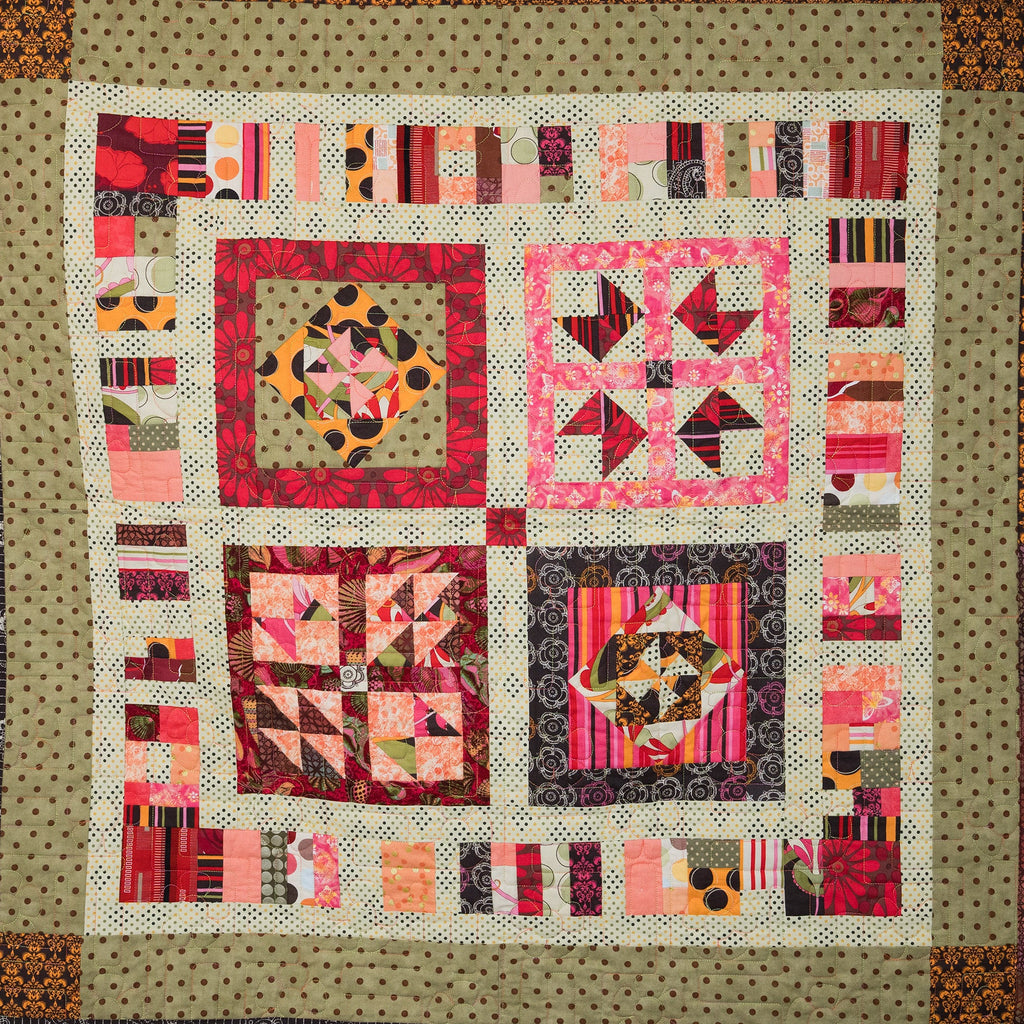 Colorful quilt with geometric patterns on a beige background
