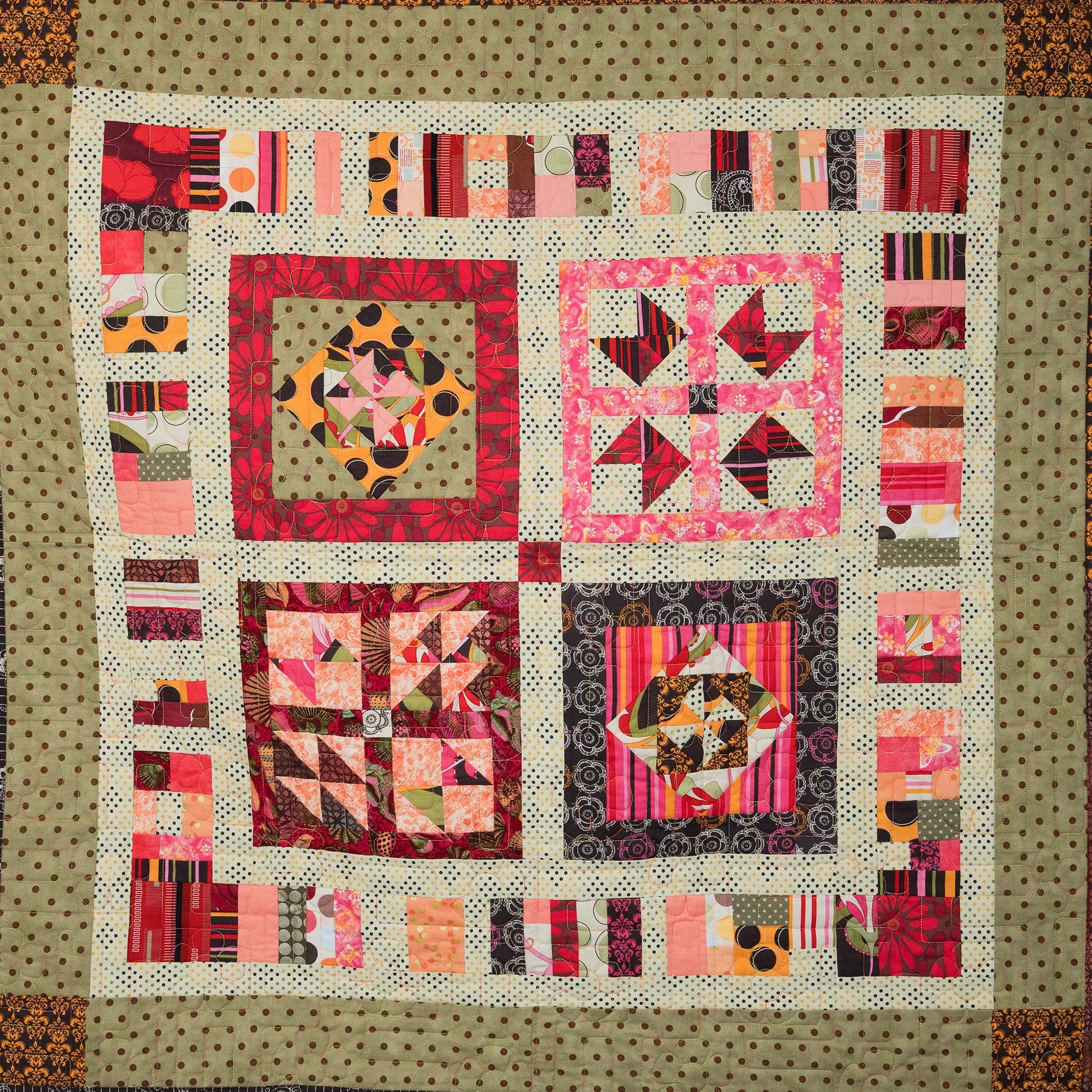 Colorful quilt with geometric patterns on a beige background