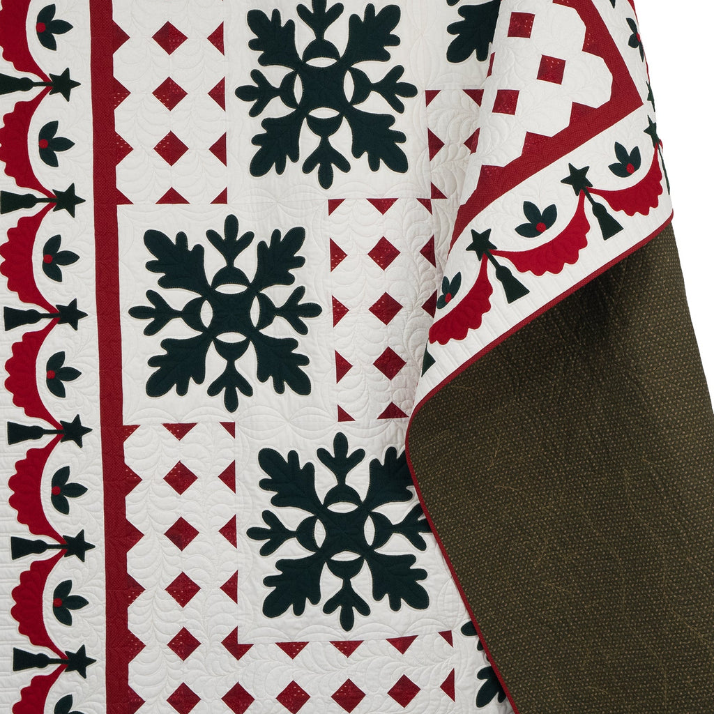 Decorative quilt with geometric pattern on a white background