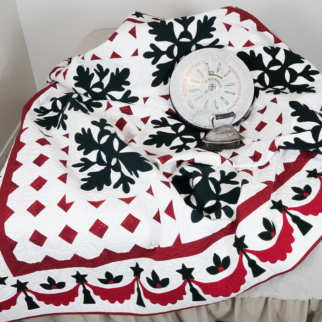 Decorative tablecloth with black, red, and white pattern on a table.