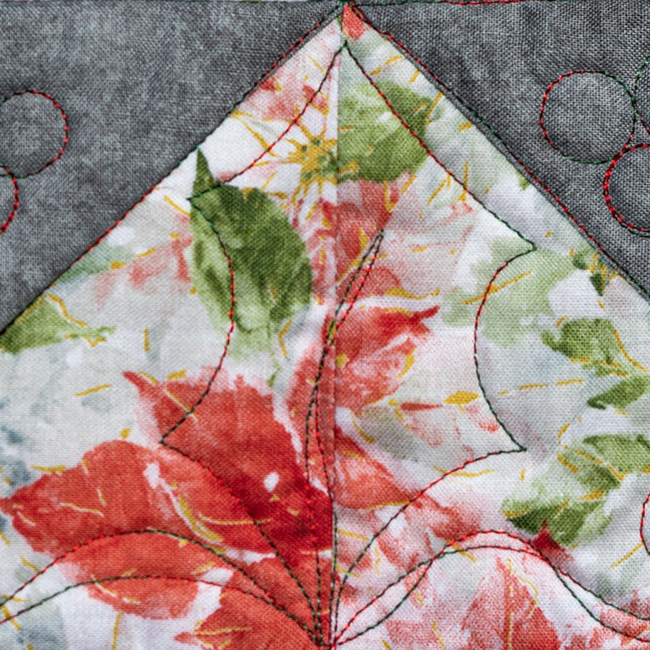 Quilted fabric block with floral design and gray border