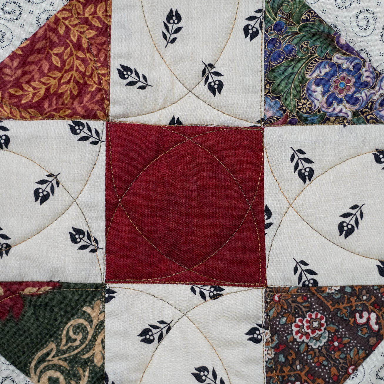 Quilt block close up featuring floral prints in a variety of colours