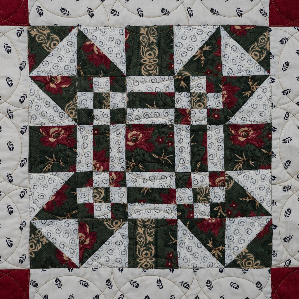 Missouri print quilt block made up of a floral red and green print
