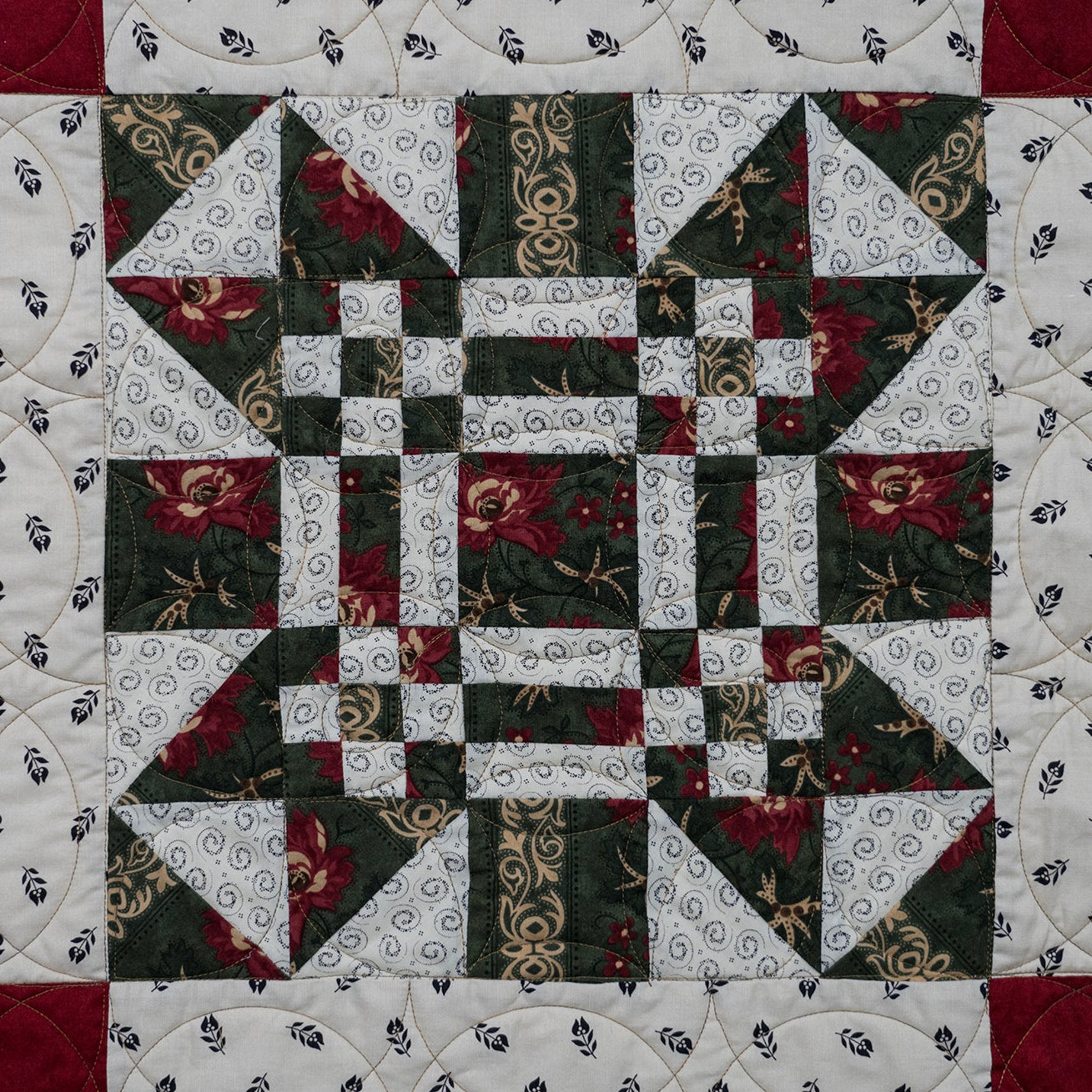 Missouri print quilt block made up of a floral red and green print