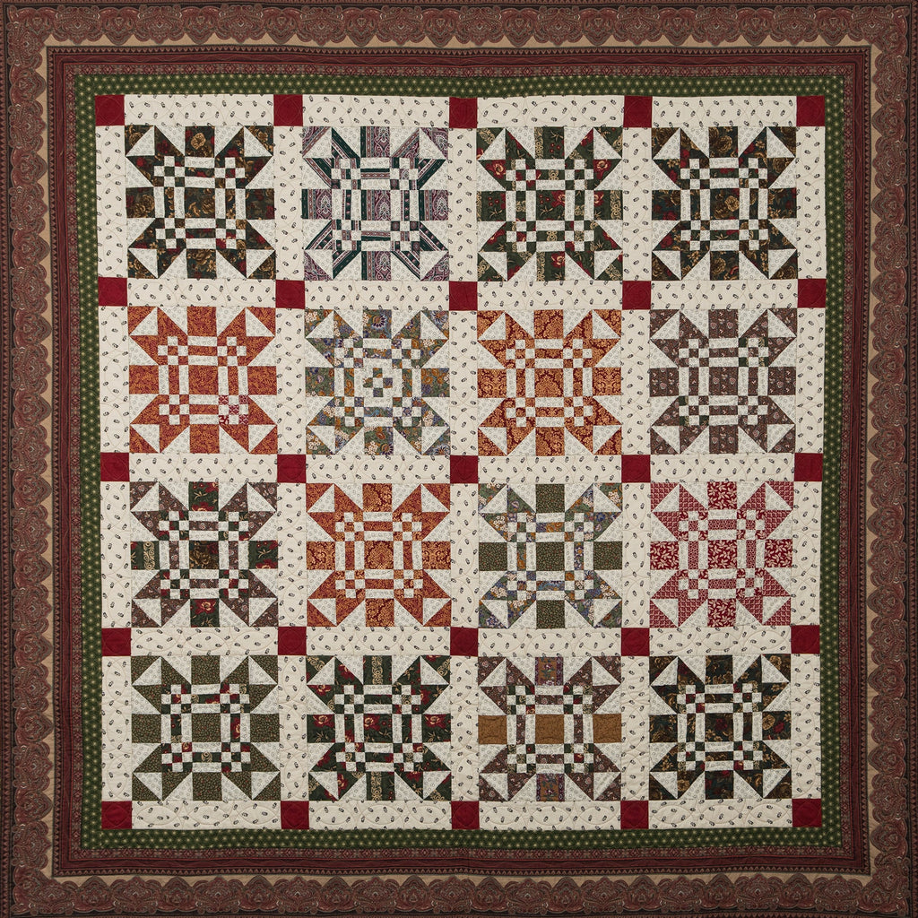 Missouri print quilt in green, orange, red and neutral tones