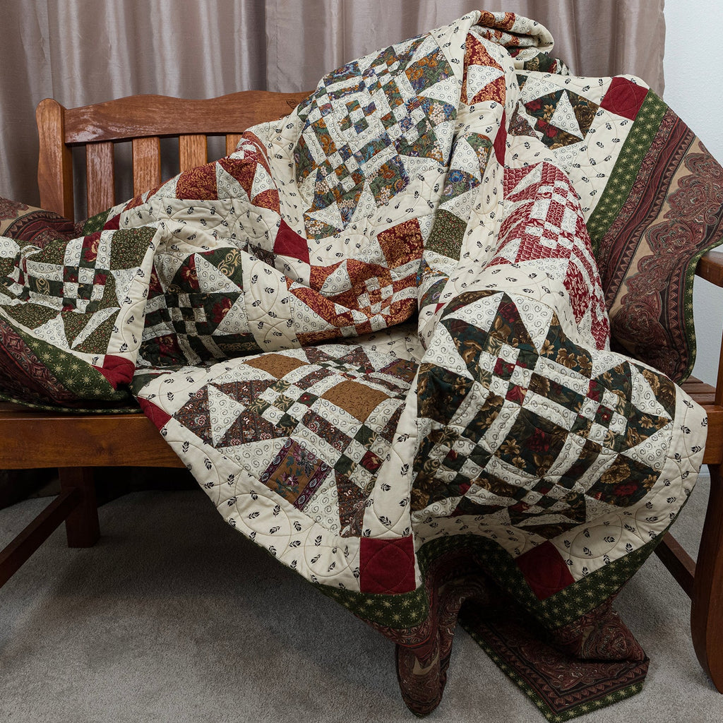 Missouri print quilt laid out on a wooden bench